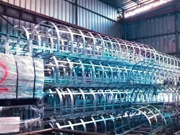 Batch of caged fixed steel ladders for warehouse use ready for galvanizing