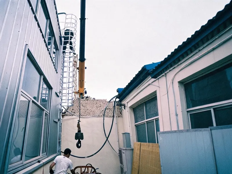Bolt-on ladder safety cage on an industrial ladder