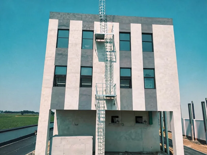 Roof access ladder with cage on a rooftop